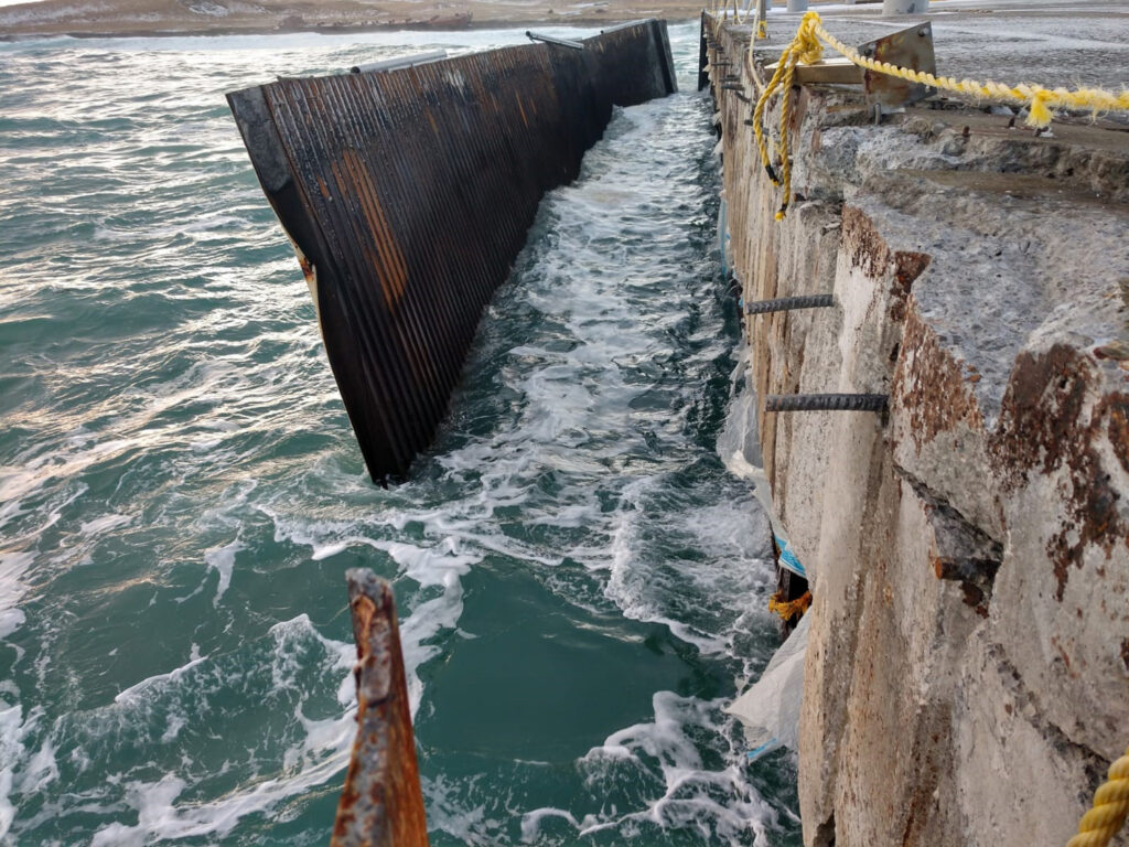 Damaged breakwater at Navy Air Station pier in Alaska